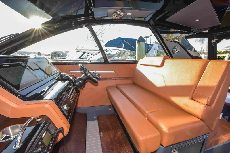 Slide: The Image of Interior of 2021 Cruisers Yachts 42 GLS OB with luxurious seating and modern dashboard. - 40