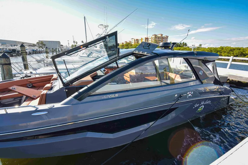 Slide: The Image of 2021 Cruisers Yachts 42 GLS OB docked, showcasing sleek design and modern features. - 5