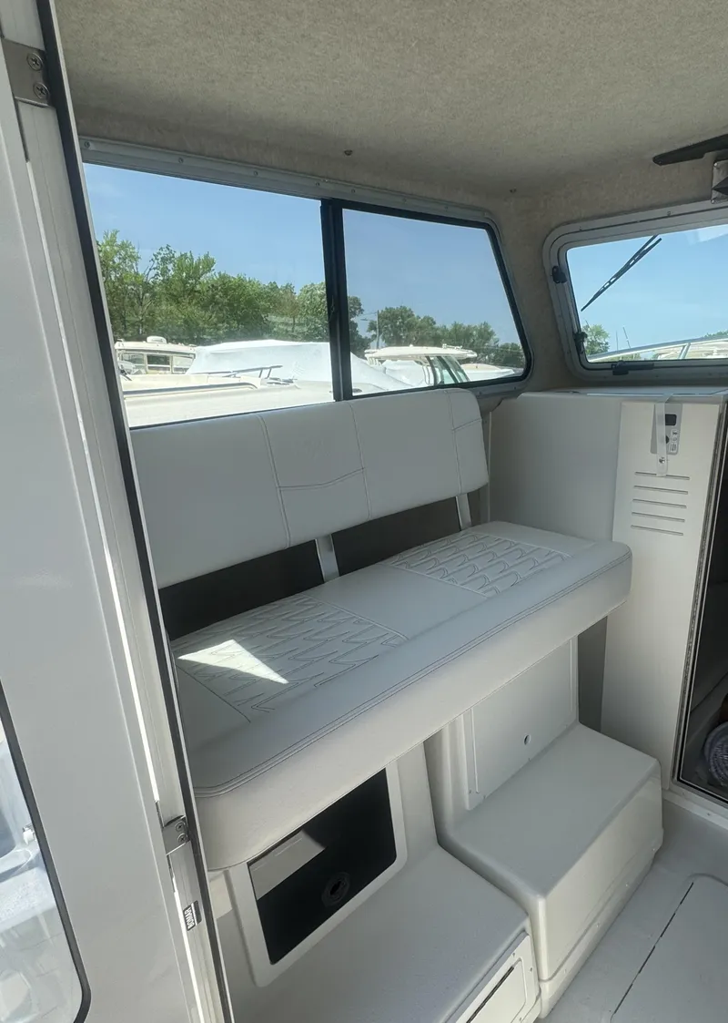 Slide: The Image of 2025 Parker 2520 XLD Sport Cabin interior with seating and windows. - 3