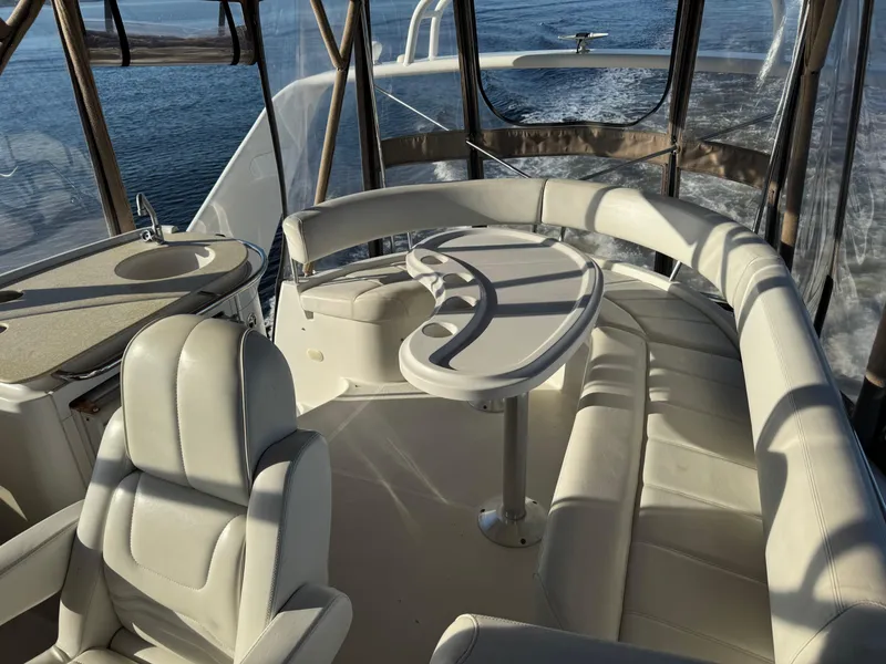 Slide: The Image of Luxurious interior of 2004 Carver 420 Mariner yacht with plush seating and table. - 16