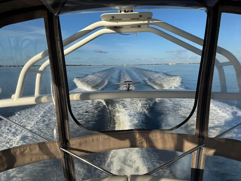 Slide: The Image of View from a 2004 Carver 420 Mariner boat, cruising on calm waters under a clear sky. - 20