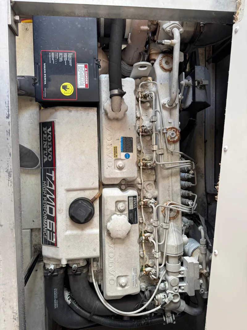 Slide: The Image of 2004 Carver 420 Mariner engine compartment with Volvo Penta TAMD 63P engine. - 5