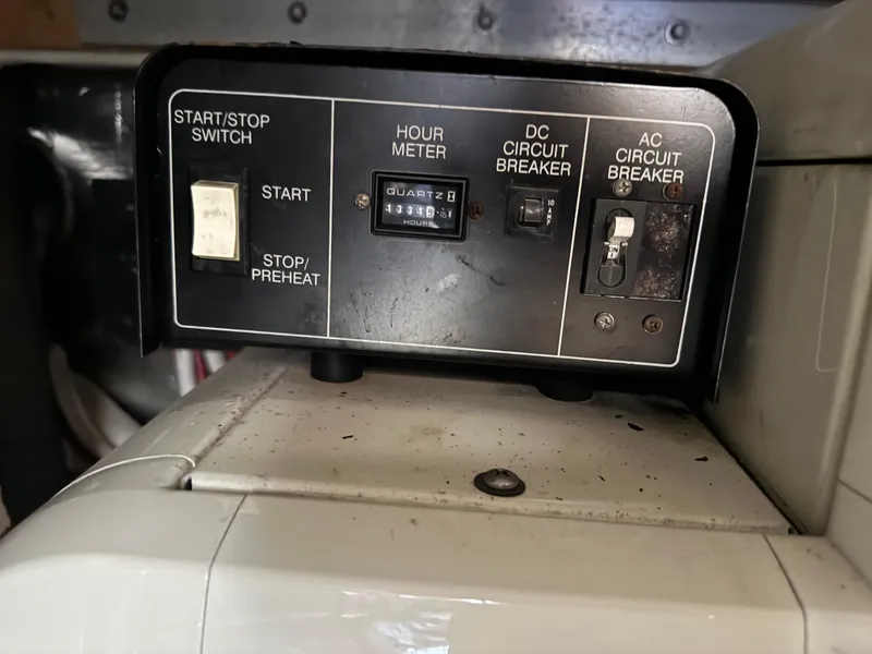 Slide: The Image of Control panel of a 2004 Carver 420 Mariner with hour meter and circuit breakers. - 6