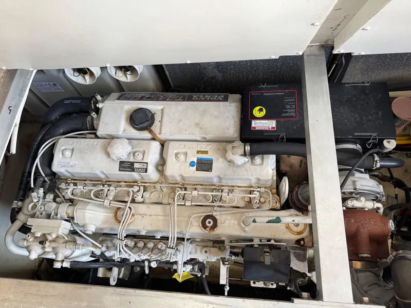 Slide: The Image of Engine compartment of a 2004 Carver 420 Mariner boat, showcasing mechanical components. - 7