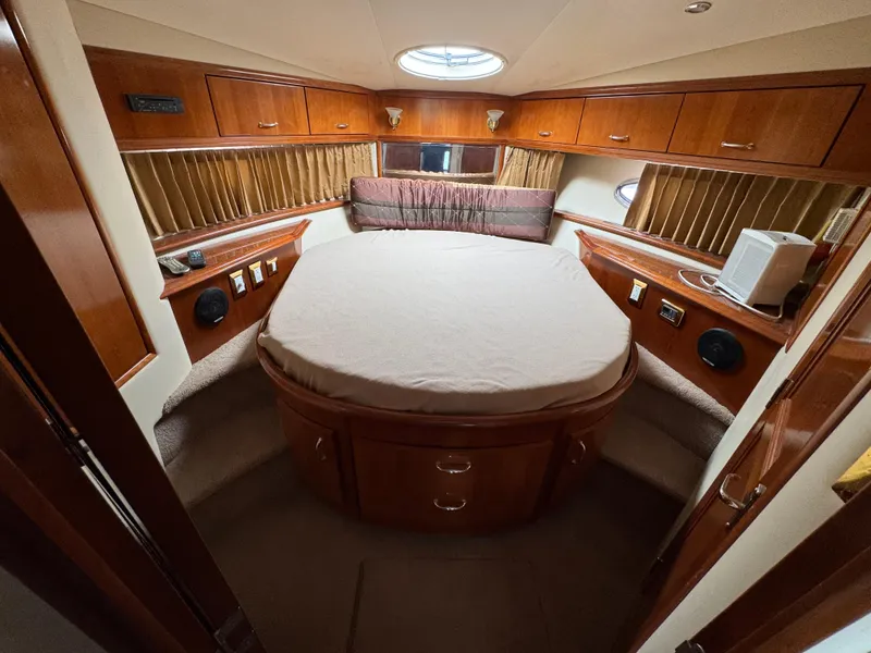 Slide: The Image of Luxurious cabin interior of 2004 Carver 420 Mariner yacht with circular bed. - 8