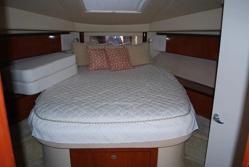 Slide: The Image of Luxurious 2004 Sea Ray Sedan Bridge cabin with cozy bed and elegant decor. - 22