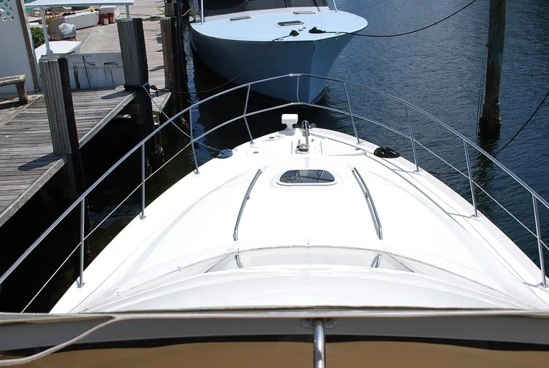 Slide: The Image of 2004 Sea Ray Sedan Bridge yacht docked at marina, viewed from bow. - 7