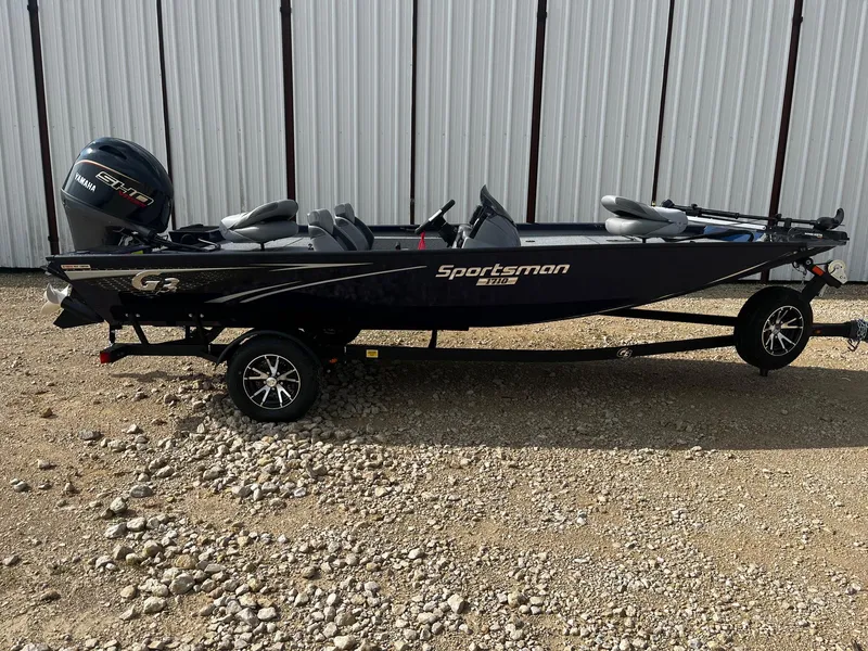 The Image of 2025 G3 Sportsman 1710 boat on trailer, parked on gravel, side view. - 0