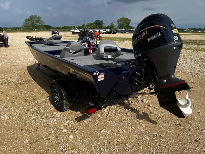 Slide: The Image of 2025 G3 Sportsman 1710 boat with Yamaha motor on gravel surface. - 5