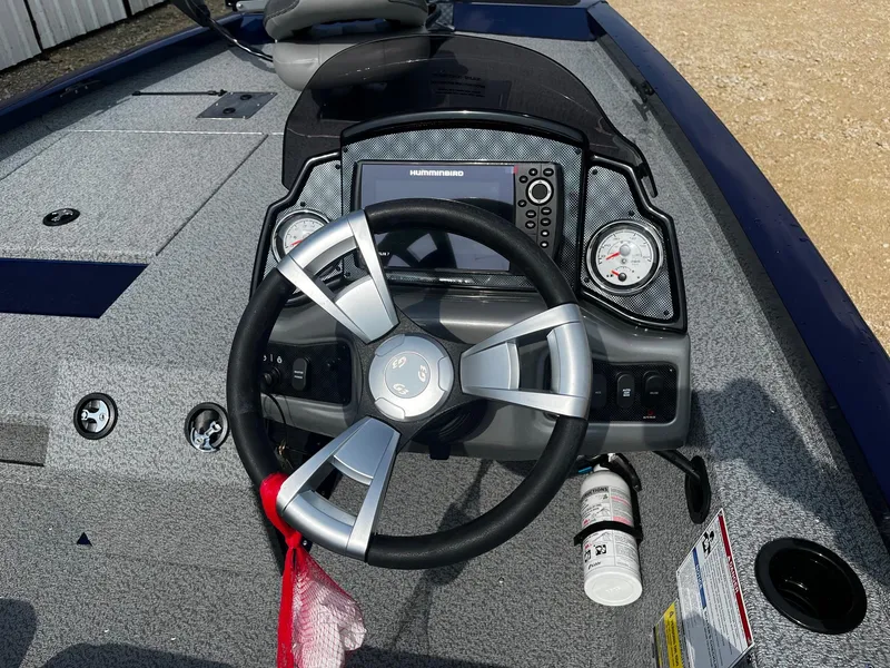 Slide: The Image of 2025 G3 Sportsman 1710 boat dashboard with steering wheel and navigation system. - 8