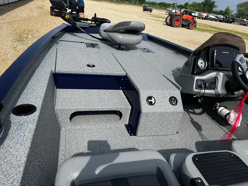 Slide: The Image of 2025 G3 Sportsman 1710 boat interior with seating and steering console. - 9