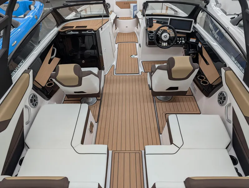 Slide: The Image of 2023 Yamaha Boats 222SD interior with luxurious seating and modern dashboard design. - 2