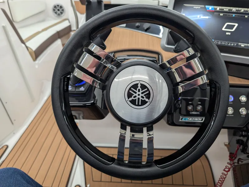Slide: The Image of Steering wheel of 2023 Yamaha Boats 222SD, featuring sleek design and modern controls. - 4