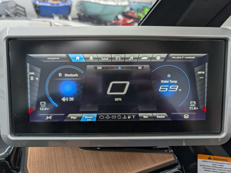 Slide: The Image of 2023 Yamaha Boats 222SD dashboard display showing speed, Bluetooth, and water temperature. - 5