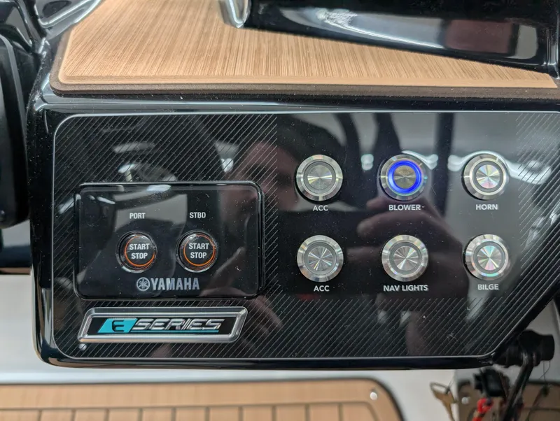 Slide: The Image of Control panel of 2023 Yamaha Boats 222SD, featuring start buttons and accessory controls. - 6