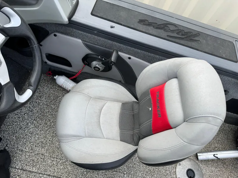 Slide: The Image of 2016 Tracker Targa V-18 Combo boat interior with gray and red seating. - 13