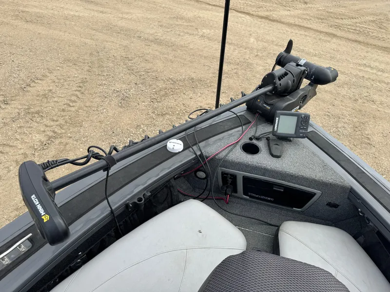 Slide: The Image of 2016 Tracker Targa V-18 Combo boat interior with trolling motor and navigation equipment. - 15