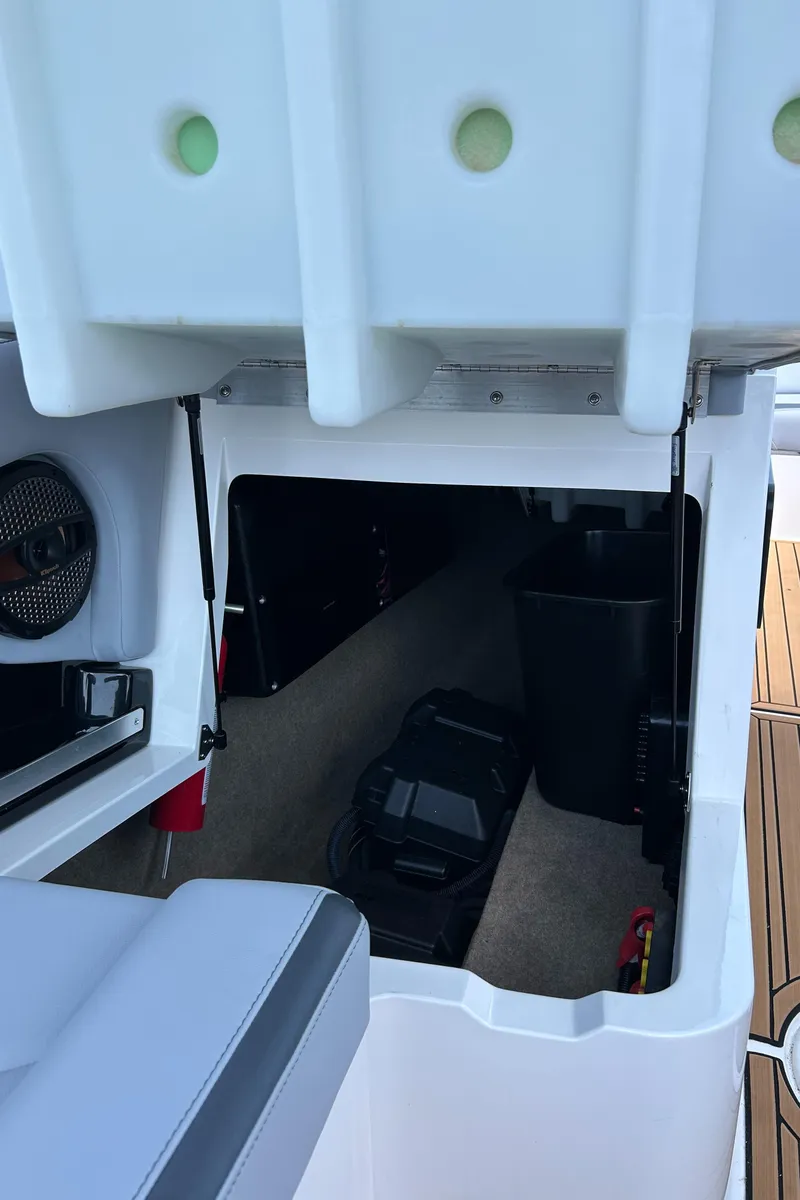 Slide: The Image of 2024 MasterCraft XStar S storage compartment with equipment and accessories. - 8