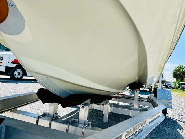 Slide: The Image of 1986 Boston Whaler 150 Sport boat on trailer, close-up view of hull. - 10