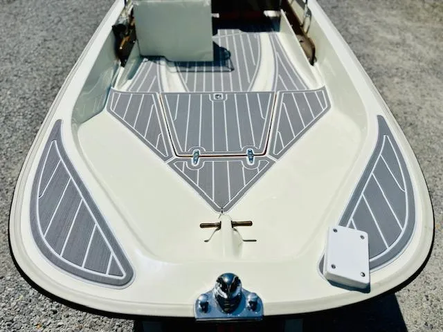 Slide: The Image of 1986 Boston Whaler 150 Sport boat deck with gray non-slip surface. - 13
