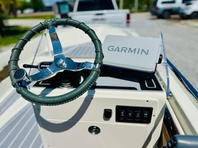 Slide: The Image of 1986 Boston Whaler 150 Sport boat dashboard with Garmin navigation system. - 16