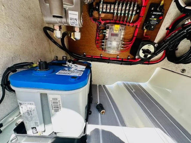 Slide: The Image of Electrical system of a 1986 Boston Whaler 150 Sport boat, featuring battery and wiring. - 27