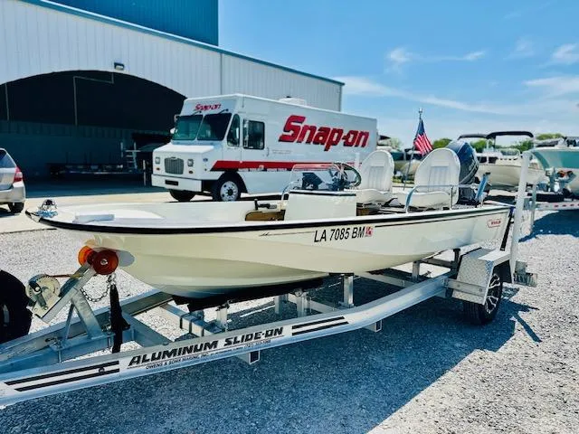 Slide: The Image of 1986 Boston Whaler 150 Sport on trailer, parked near Snap-on truck. - 9
