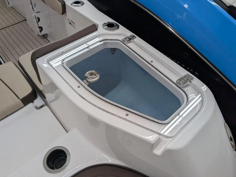 Slide: The Image of 2024 Yamaha Boats 255 FSH Sport H, featuring a sleek onboard storage compartment. - 2
