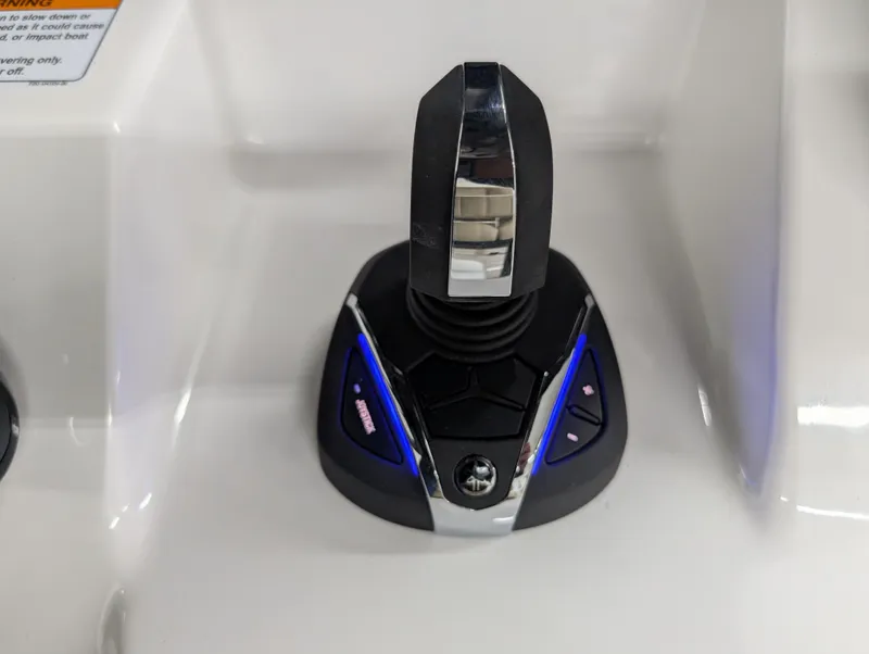 Slide: The Image of Yamaha Boats 2024 255 FSH Sport H throttle control with sleek design and illuminated buttons. - 9