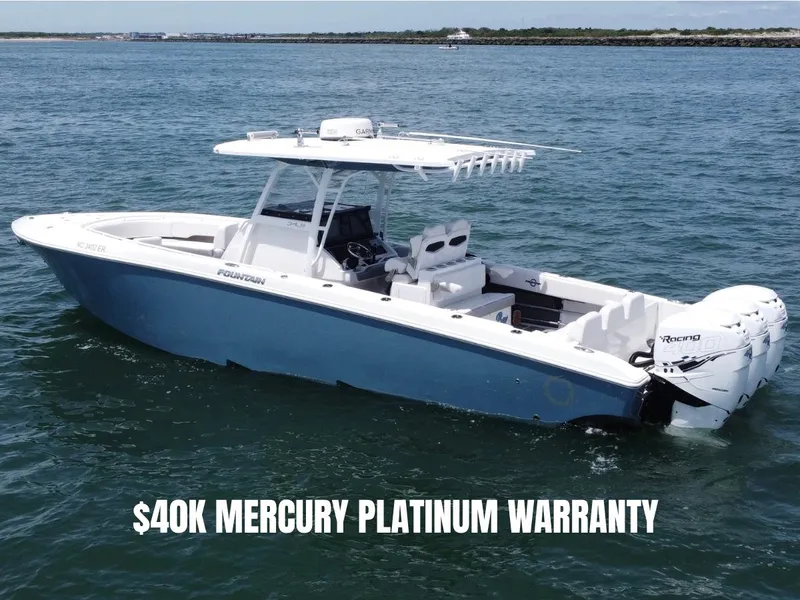 Slide: The Image of 2021 Fountain 34 CC LS boat on water with $40K Mercury Platinum Warranty. - 0