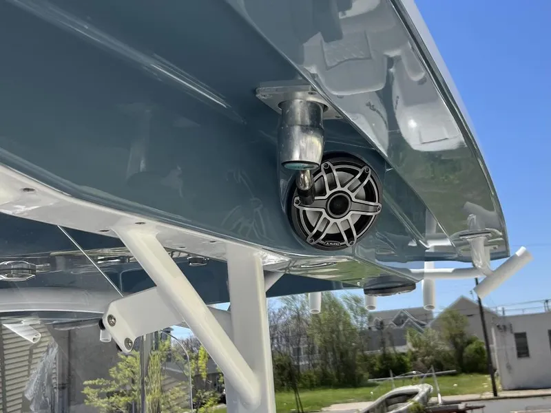 Slide: The Image of 2021 Fountain 34 CC LS boat underside with speaker and metal fixtures. - 11