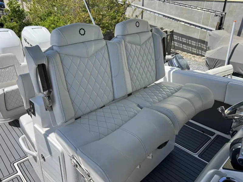 Slide: The Image of 2021 Fountain 34 CC LS boat with luxurious white leather seating. - 13