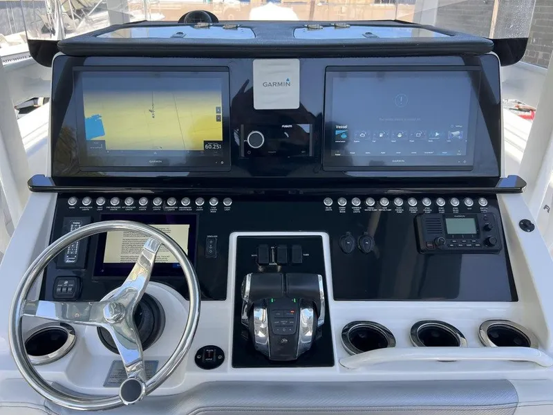 Slide: The Image of Control panel of 2021 Fountain 34 CC LS boat with Garmin navigation system. - 19