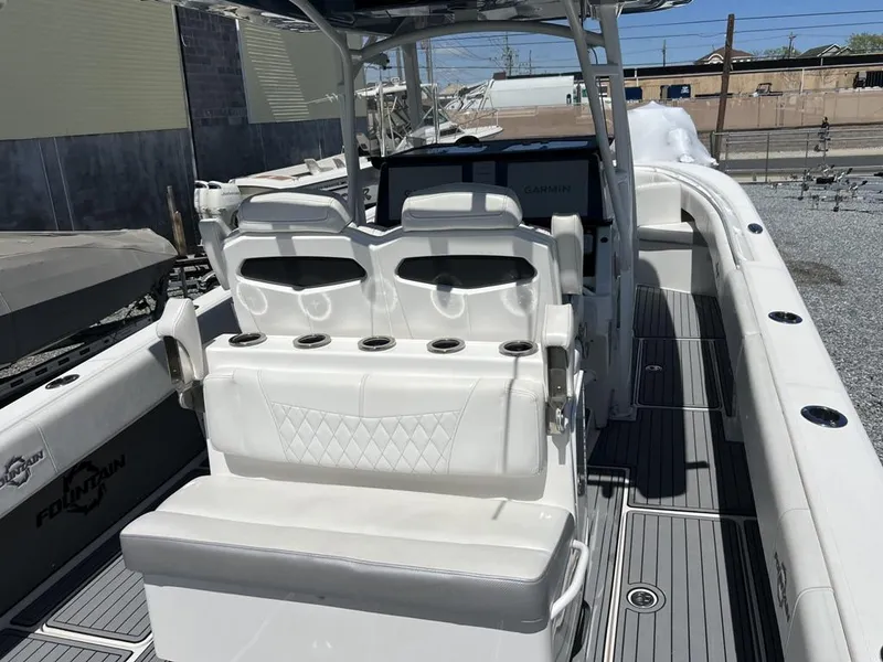 Slide: The Image of 2021 Fountain 34 CC LS boat interior with white seating and modern design. - 6