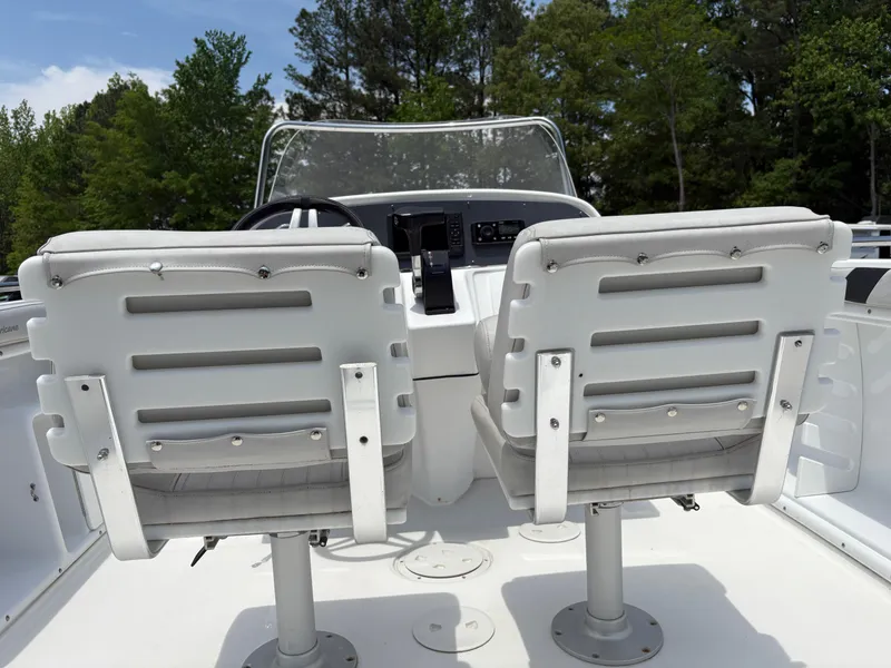 Slide: The Image of 2021 Hurricane Center Console SS 231 OB boat with dual white seats and control panel. - 10