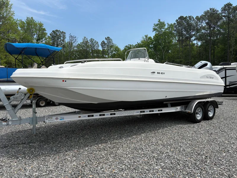 Slide: The Image of 2021 Hurricane Center Console SS 231 OB boat on trailer, parked outdoors. - 11