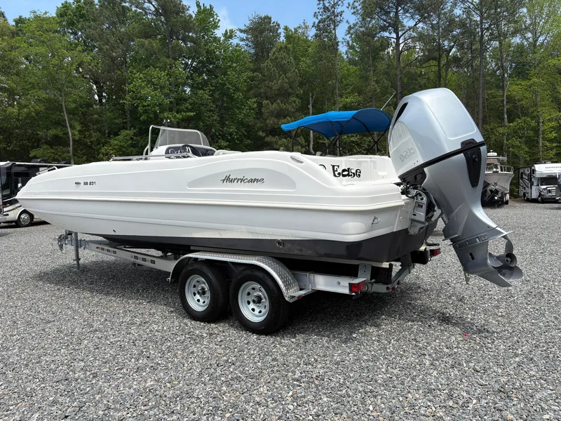 Slide: The Image of 2021 Hurricane Center Console SS 231 OB boat on trailer, parked outdoors. - 12