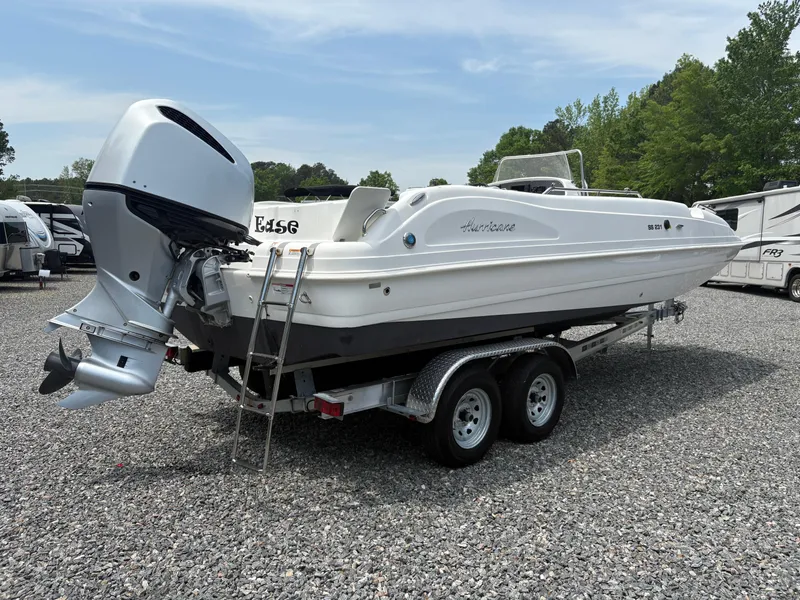 Slide: The Image of 2021 Hurricane Center Console SS 231 OB boat on trailer, parked outdoors. - 14