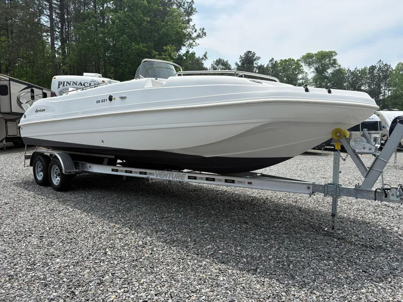 Slide: The Image of 2021 Hurricane Center Console SS 231 OB boat on trailer, parked on gravel. - 15