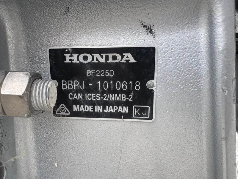 Slide: The Image of Honda engine label on a 2021 Hurricane Center Console SS 231 OB, made in Japan. - 18