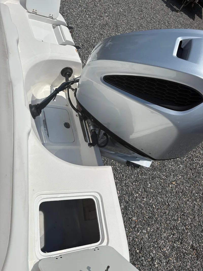 Slide: The Image of 2021 Hurricane Center Console SS 231 OB boat engine and storage compartments. - 4