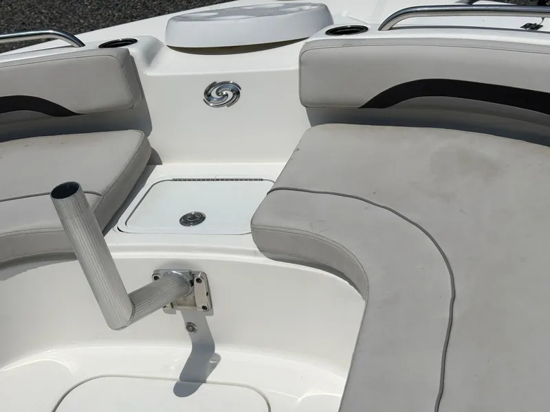 Slide: The Image of 2021 Hurricane Center Console SS 231 OB boat interior with cushioned seating and rod holder. - 9