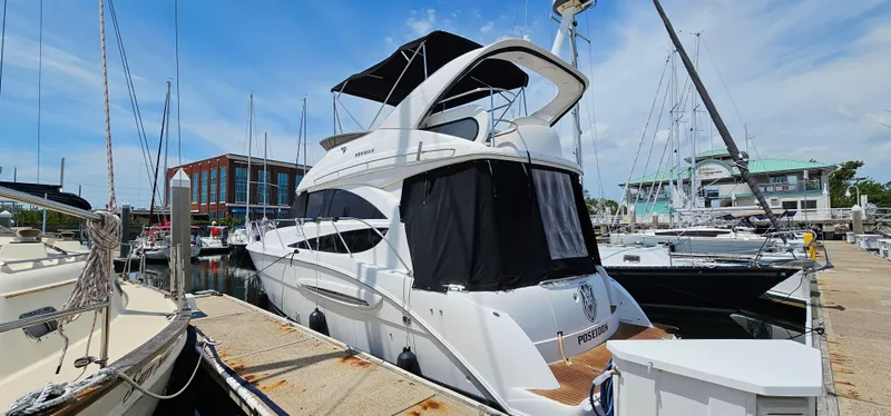 Slide: The Image of 2007 Meridian 341 Sedan yacht docked at marina under clear blue sky. - 10