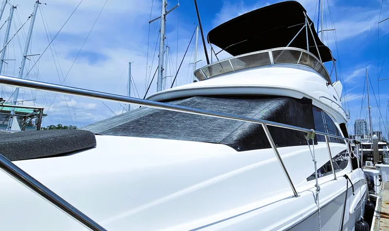 Slide: The Image of 2007 Meridian 341 Sedan yacht docked at marina under clear blue sky. - 11