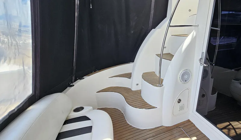 Slide: The Image of 2007 Meridian 341 Sedan yacht interior with curved stairs and seating area. - 14