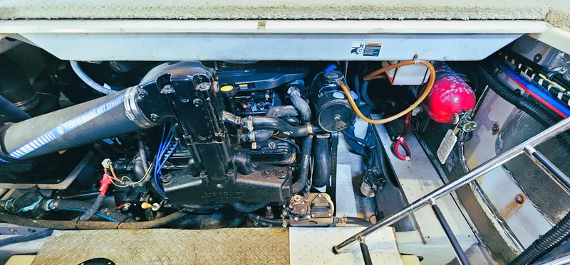 Slide: The Image of Engine compartment of a 2007 Meridian 341 Sedan boat, showcasing mechanical components. - 21