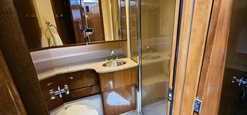 Slide: The Image of 2007 Meridian 341 Sedan bathroom with wood cabinetry, sink, and shower. - 8