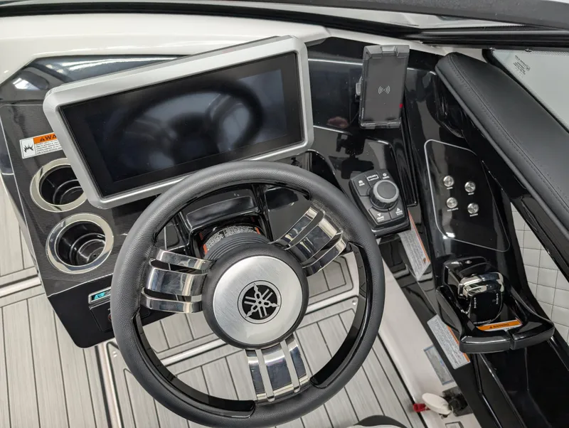 Slide: The Image of 2024 Yamaha Boats 275 SE dashboard with steering wheel and touchscreen display. - 10