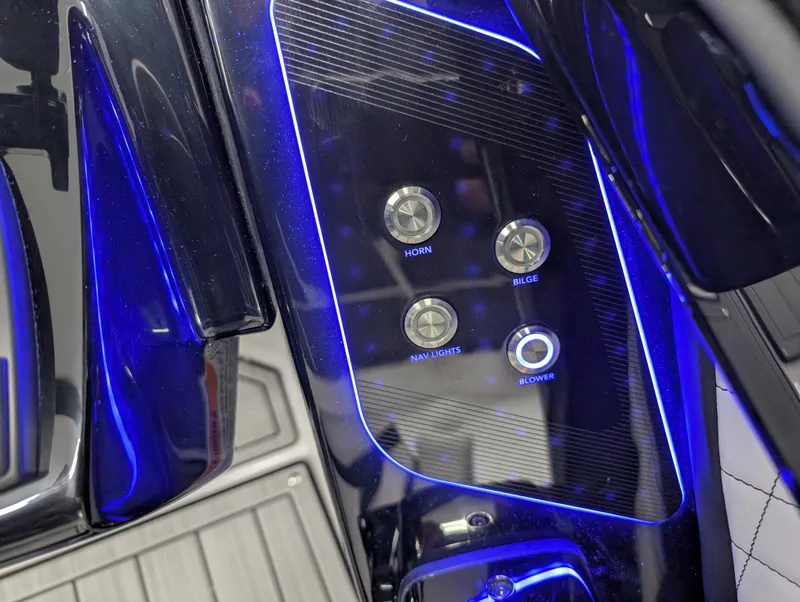 Slide: The Image of Control panel of 2024 Yamaha Boats 275 SE with illuminated buttons for horn, bilge, nav lights, blower. - 15