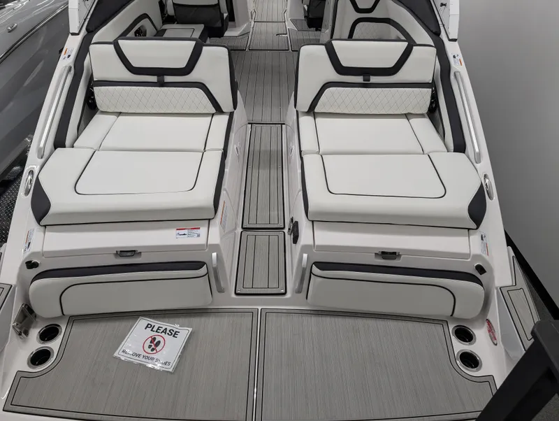 Slide: The Image of 2024 Yamaha Boats 275 SE interior with luxurious seating and modern design. - 2